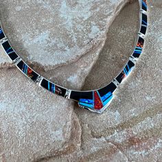 Artisan Red Jewelry With Inlay, Artisan Red Inlay Jewelry, Red Sterling Silver Jewelry With Inlay, Unique Blue Necklace With Inlay, Blue Necklace With Round Inlay, Unique Multicolor Inlay Necklaces, Unique Multicolor Inlay Necklace, Red Multi-stone Necklaces As Gifts, Red Multi-stone Necklace For Gift