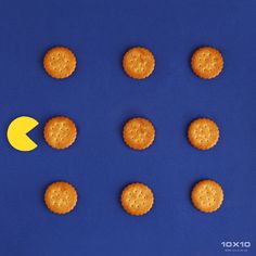 crackers arranged in the shape of an arrow on a blue background