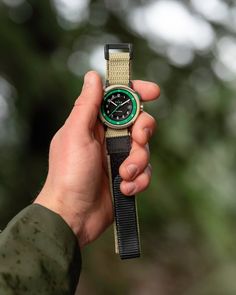 Inspired by the iconic colors the Forest Service Rangers wear, Vero’s latest field watch is just as reliable as the guardians of America’s woodlands. Powered by Seiko Kinetic Movement that stores and replenishes energy based on your movement, the watch has a stainless steel case with a scratch-resistant, color-tinted ceramic coating. The green and black dial includes a date window and the ability to track your power reserves with the push of a button. Functional Green Watch With 10atm Water Resistance, Functional Green Watches For Outdoor Activities, Green Analog Outdoor Watch, Green Analog Display Watch For Outdoor, Green Watches For Outdoor Activities, Outdoor Analog Display Watches, Durable Green Watches For Outdoor Activities, Green Analog Watches For Outdoor Activities, Outdoor Watch Accessories With Analog Display