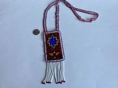 Indigenous Beaded Jewelry, Long Indigenous Necklace, Native American Ethnic Jewelry, Aboriginal Art, Authentic First Nations Art. The size of the rectangle (without tassel): 4.25" x 2.5"; Length of the neck chain/strap: 29". Beautiful condition Leather on the back. Let me know if you need any more pictures  ATTENTION: Small Packet (only for US and International) shipping option doesn't include Tracking Number!! * Small Packet US - approx 6-12 business days; * Tracked Packet US - approx 5-10 busi Traditional Beaded Necklaces For Crafting Festivals, Traditional Rectangular Necklace For Festivals, Traditional Beaded Fringe Necklace As Gift, Traditional Beaded Fringe Necklace, Traditional Multicolor Rectangular Necklace, Artisan Handwoven Rectangular Jewelry, Traditional Beaded Rectangular Necklaces, Traditional Rectangular Jewelry With Colorful Beads, Traditional Beaded Rectangular Necklace