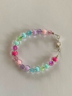 🎀 Add a pop of color to your look with the Pastel Candy Dreams Bracelet 🎀 I make all my jewelry handmade and from recycled beads. This bracelet is adjustable and customizable. Please message me with any special requests and I will make them happen. Rainbow Colorful Beads Bracelets For Crafting, Rainbow Bracelets With Colorful Beads For Crafting, Adjustable Multicolor Beaded Bracelets For Birthday, Rainbow Beaded Bracelets With Large Beads As Gift, Colorful Round Beads Bracelets For Crafting, Rainbow Colorful Beads Bracelet For Crafting, Colorful Round Bead Bracelets For Crafting, Colorful Adjustable Bracelets For Birthday, Colorful Bracelet Jewelry For Birthday