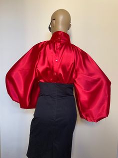 "This is a very stylish Womens Satin blouse in beautiful Candy apple red color. It is comfortable and cozy. Made for a free flowing fit. Great for all year around and for any special occasion or casual day can be dressed up or dressed down. SIZE CHART SIZE S - US 6, UK 8, EU 36 bust: bust around 34.5\"/90cm Waist: waist around 27.5\"/70cm Hips: hips around 34.5\"/90cm SIZE M - US 8, UK 10, EU 38 bust: bust around 37.5\"/95cm Waist: waist around 29.5\"/75cm Hips: hips around 37.5\"/95cm SIZE L - Chic Red Blouse For Evening, Red Long Sleeve Blouse With Blouson Sleeves, Chic Red Party Blouse, Red Blouse With Blouson Long Sleeves, Red Satin Party Blouse, Red Long Sleeve Blouse For Evening, Formal Red Padded Blouse, Red Lantern Sleeve Blouse For Fall, Silk Red Blouse For Party