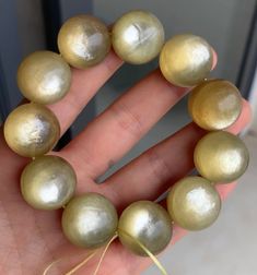 Material:golden mica beads size :  19mm quantity: one strand  6mm approx 29 pcs one strands 7mm approx25 pcs one strands 8mm approx 22 pcs one strands 9mm approx 21pcs one strands 10mm approx 19 pcs one strands 11mm approx 18pcs one strands 12mm approx 16 pcs one strands 13mm approx 16 pcs one strands 14mm approx 15 pcs one strands 15mm approx 14pcs one strands 16mm approx 14 pcs one strands 17mm approx 13pcs one strands 18mm approx 13pcs one strands 19mm approx 12pcs one strands 20mm approx 12p Gold Bracelets With Polished Beads For Healing, Gold Bracelets With Large Beads, Gold Beaded Bracelet With Large Beads For Gift, Gold Beaded Bracelets With Large Beads As Gift, Gold Hand-strung Round Beads, Gold Beaded Bracelets With Large Beads, Gold Beaded Bracelets With Gemstone, Yellow Beaded Gemstone Bracelets, Yellow Gemstone Beads Bracelet