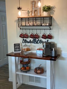 a coffee bar with shelves and hanging utensils