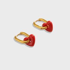 The Lover Rouge Huggie Earrings are designed with a stunning red heart pendant, designed to make a statement. Wear these trans-seasonal earrings to elevate any outfit for any occasion. Love these earrings and keep them safe in the Biella Vintage Jewellery box provided. 18K Gold plated Red pendant heart Biella Vintage Jewellery Box Free Worldwide Shipping Trendy Earrings For Valentine's Day Gift, Trendy Valentine's Day Earrings For Gift, Trendy Valentine's Day Gift Earrings, Trendy Heart Drop Earrings As Gift, Trendy Heart-shaped Earrings For Gifts, Trendy Heart Shaped Earrings For Gifts, Trendy Red Drop Earrings, Red Heart-shaped Earrings For Her, Trendy Red Heart Pendant Jewelry