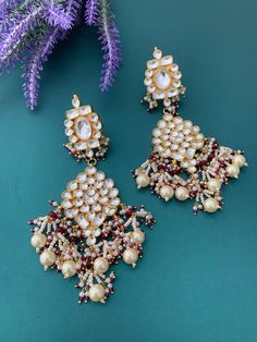 About 5 inch long and 2inch wide . Pachi kundan earring. High high quality Ahmedabadi pachi kundan and Hydrabadi pearl work.  Push back . Traditional Kundan Pearl Earrings With Stone Work, Traditional White Kundan Chandelier Earrings, Traditional Heavy Kundan Pearl Earrings, Kundan Danglers With Mirror Work, White Meenakari Kundan Chandelier Earrings, White Kundan Chandelier Earrings With Meenakari, Traditional White Kundan Danglers, Pearl Work, Polki Necklace