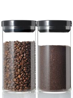 two glass jars filled with coffee beans