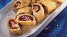 several pastries on a white plate next to an american flag