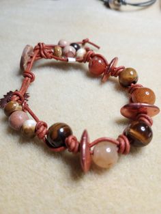 On Sale now $22.99(was $27.99) Hand knotted, beaded jasper & agate, leather, gemstone, bracelets for women! handcrafted leather bracelets, easy button clasp. 2 styles of beautiful gemstones! orange/stripe beads 8" and Jasper/copper 7.5" adjustable/easy button bead clasp! Bohemian Leather Bracelets For Everyday Wear, Adjustable Hand Wrapped Leather Wrap Bracelet, Handmade Casual Leather Bracelets, Casual Handmade Leather Bracelets, Casual Brown Leather Beaded Bracelets, Casual Leather Jewelry As Gift, Adjustable Leather Bracelets With Natural Stones, Handmade Adjustable Leather Wrap Bracelet, Adjustable Leather Beaded Bracelets With Round Beads