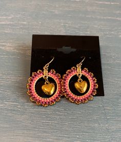 Handmade gold heart enclosed in a pink beaded circle. Circle approximately 1" Heart Beaded Earrings, Beaded Circle, Circle Circle, Gold And Pink, Handmade Gold, Heart Beads, Gold Heart, Heart Of Gold, Pink Heart