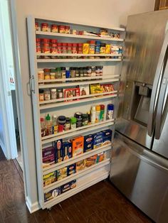 an organized pantry in the corner of a kitchen