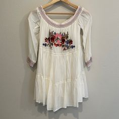 Nwt Xs Free People Ivory Sun Beams Embroidered Mini Dress! Second Owners. Purchased From Posh. Perfect Condition With Tags Still Attached. Smocked Of The Shoulder Neckline And Sleeve Cuffs. Floral Embroidery On The Front. Fully Lined. White Embroidered Mini Dress For Brunch, Spring White Mini Dress With Embroidered Hem, White Embroidered Hem Mini Dress For Spring, White Mini Dress With Embroidered Hem For Spring, Embroidered White Long Sleeve Mini Dress, White Embroidered Long Sleeve Mini Dress, White Embroidered Mini Dress For Spring, Cream Spring Dress With Embroidered Hem, White Long Sleeve Embroidered Mini Dress