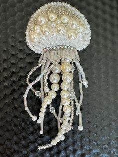 Handmade wedding embroidery jellyfish brooch& earrings ,white beet brooch & earrings set, unique gift for her. Size of brooch 12*6cm size of earrings 6 cm long Beads Brooch, Beach Christmas Ornaments, Wedding Brooches, Retro Christmas Decorations, Wedding Embroidery, Unique Brooch, Beach Christmas, Wedding Brooch, Seashell Crafts