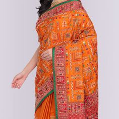 Step into a world of beautiful sarees with this stunning Transitional Gharchola in Orange and Red. Made from gaji silk, it features a combination of resham and zardosi embroidery, with beautiful motifs in a traditional and transitional pattern.It's the perfect way to add a touch of elegance to any outfit, whether you're attending a special event or just want to add a little something extra to your everyday look. So why not treat yourself to this unique and gorgeous gharchola today? Fall and Pico Red Tussar Silk Pre-draped Saree With Motifs, Traditional Tussar Silk Pre-draped Saree For Navratri, Traditional Dola Silk Wear For Traditional Ceremonies, Traditional Dola Silk Wear For Ceremonies, Festive Traditional Wear With Multicolor Embroidery, Festive Traditional Drape With Multicolor Embroidery, Banarasi Silk Saree With Resham Embroidery For Festivals, Navratri Zari Woven Embroidered Saree Fabric, Orange Semi-stitched Saree With Resham Embroidery