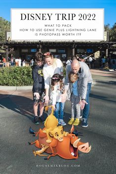 three children and two adults standing in front of a sign that says disney trip 2092