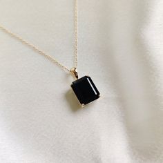 This stunning pendant is set in 14k Solid Yellow Gold with Natural Black Onyx with utmost precision. It is a unique gemstone pendant for nearly every occasion and is completely hassle-free jewelry. ITEM DETAILS: * GEM: Black Onyx * GEM Size: 10x12mm * GEM Shape: Octagon (Emerald Cut) * Gem Weight: 6.00 carats * Gold Purity: 14KT  * Gold Weight: 1.07 gram * Total Weight of the Pendant: 2.27 gram The Gold purity is guaranteed and it comes with an authentic 14KT gold hallmark. Since my items are ha Black Gem Necklace, Black 14k Gold Pendant Jewelry, Black Enamel 14k Gold Necklace, Formal Black Onyx Necklace, Yellow Gold Black Spinel Jewelry As A Gift, Fine Jewelry Black Necklace With Black Enamel, Black Onyx Jewelry For Formal Occasions, Black Pendant Jewelry For Anniversary, Black Enamel Necklace For Anniversary