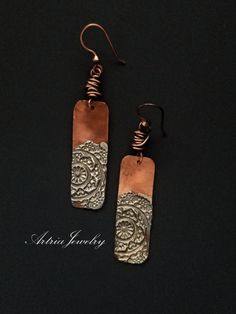 "These Copper Bar Earrings with Silver Solder Mandalas are a great pair of mixed metal earrings. Accented with copper wire knots. These earrings are part of our Mandala Collection. Sterling Silver Earwires Mandala Pendant/Necklace is available at - https://www.etsy.com/listing/1146736586/mandala-stamped-silver-solder-copper-bar?click_key=633ba3534eaf06a06972618af41db3e2122b0e08%3A1146736586&click_sum=1ecac27d&ref=shop_home_active_1  Mandala in Sanskrit is the term for the universe. Mandalas are Handmade Rectangular Copper Earrings, Handmade Rectangular Metal Earrings, Rectangular Copper Earrings With Ear Wire, Sheet Metal Jewelry, Mandala Earrings, Hammered Jewelry, Copper Bar, Mixed Metal Earrings, Tree Of Life Necklace