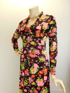 "Vintage 70s long sleeve floral maxi dress, deep wine with pink and orange floral. Sweet 70s maxi dress with long sleeves with ruffled V neck and hem. Full metal zipper in the back. It has a fitted bodice and drapes beautifully. I believe it's a polyester blend and does have some stretch to it. Measured flat Shoulders 15\" Sleeve 22\" Underarms 16\" 32\" bust waist 14\" 28\" waist Hips 18\" 36\" hip Length 54\"" Fitted V-neck Maxi Dress For Fall, Fitted V-neck Printed Dresses, Fall Fitted V-neck Maxi Dress, Spring Party Vintage Maxi Dress, Fitted Bohemian Spring Dresses, Bohemian Fitted Spring Dresses, Bohemian Fitted Dresses For Spring, Chic Fitted Spring Vintage Dress, Fitted V-neck Maxi Dress For Winter