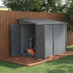 a metal shed sitting on top of a wooden deck