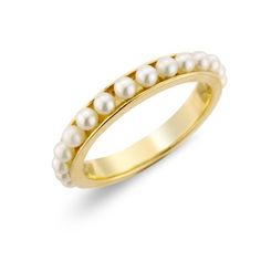 an 18k yellow gold ring with pearls