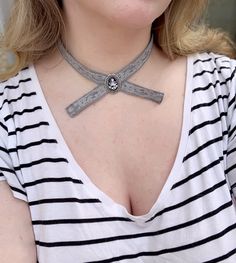 This is my version of the family crest choker as seen worn by the amber eyed vampire family. The crest is set behind glass into an antiqued silver bezel. Its attached to a 14 inch choker with an adjustable clasp. The choker is made of cotton and lace, carefully stitched together to give it a unique antique shabby chic feel. This makes an excellent gift for a loved one or yourself. Family Crest Necklace, Vampire Family, Amber Eyes, Prayer Bracelet, Unique Antiques, Necklace Choker, How To Make Shorts, Family Crest, Choker Necklaces