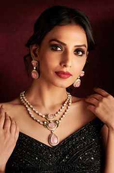 Adorn yourself with sophistication in this Polki double-layered necklace, embellished with exquisite pink-colored stones. Complete with matching earrings, this set is perfect for adding a touch of elegance to your reception ensemble. Finish: Rhodium Material: Brass, Polkis & Pink Stones Color: Pink Size: Free Size, Adjustable Closure Type: Draw String Box Contains: 1 Necklace, 1 Pair of Earrings Elegant Pink Hand Set Jewelry Sets, Elegant Pink Necklace For Reception, Hand Set Pink Necklace For Celebrations, Pink Hand Set Necklace For Celebration, Pink Hand-set Necklace For Celebrations, Pink Kundan Necklace With Hand-set Details, Hand Set Pink Necklaces For Festive Occasions, Pink Hand Set Bridal Necklace For Party, Pink Hand-set Bridal Necklace For Party