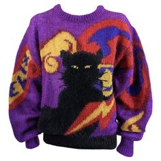 Charming and collectable Krizia Felix black cat oversized signature pullover crewneck sweater in soft knit blend. "Felix" the cats name is knitted into right sleeve. 1980's Italy. Size 42. Excellent Condition, Angora 20%.Mohair 70%,Polyester 10% Length 24", Hem 26" Shoulder 6", Sleeve 26" 90s Style Purple Fall Sweater, 90s Style Purple Sweater For Fall, Cats Name, Angora Sweater, Graphic Sweaters, Sweater Dresses, Oversize Knit, Cool Sweaters, Knitted Pullover Sweaters