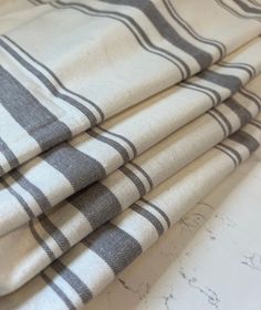 four black and white checkered fabric on top of each other, all folded together