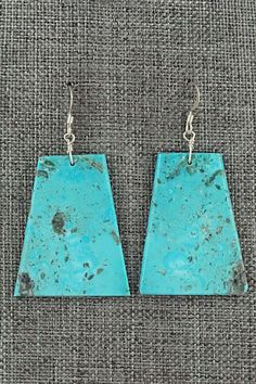 These turquoise and sterling silver earrings were made by Santo Domingo silversmith Lupe Lovato.Height: 2 1/8"Width: 1 1/8"Free shipping on all orders! We ship with USPS and always include tracking. All orders ship within a day of payment.Returns are accepted up to 30 days after you receive your order. Just send us a message. Our shop offers cash back or store credit. The item must be returned in new condition. Turquoise Sterling Silver, Sterling Silver Earrings, Silver Earrings, Jewelry Watches, Jewelry Earrings, Turquoise, Sterling Silver, Free Shipping, Silver