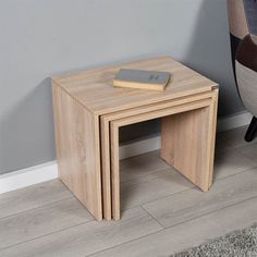 a small wooden table with a book on top