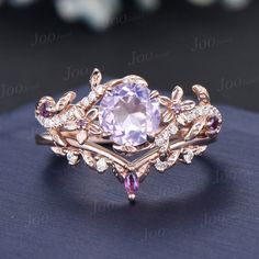 a ring with an amethorate surrounded by diamonds