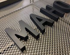 the letters are made out of black plastic