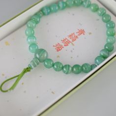 Green Banded Agate Bracelet Characteristics of the product Material : Green Banded Agate, Silk elastic cordWrist size : about 17cm (Stretch)We adjust the size to your wrist for a fee.Head beads : about 10mmMain beads : about 7mm Handmade in Kyoto, JAPAN About Green Banded Agate Green agate is considered a healing stone with a multitude of properties. It is believed to dispel negative energies, boosting self-confidence and self-esteem. It is also associated with health, luck, harmony, beauty, and Kumihimo Bracelets, Traditional Ceramics, Amber Bracelet, Agate Bracelet, Kyoto Japan, Banded Agate, Green Agate, Vintage Japan, Fabric Paper