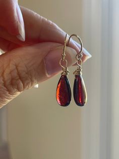 Such a unique and gorgeous stone! Bright glowly garnet hangs from gold filled or sterling silver ear wires 30mm drop Garnet Teardrop Earrings, Garnet Drop Earrings, Raw Garnet, 50th Birthday Gifts For Woman, January Birthstone Jewelry, 30th Birthday Gift, Dangle Earrings Gold, Raw Crystal Jewelry, Birthday Gift For Women