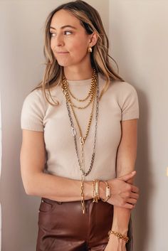 Elevate your casual style with the Loni Paul Mixed Chain Necklace. Made of four layers of gold chains, this one-of-a-kind necklace features a mix of chain links for a contemporary and fashionable look. Perfect for versatile and stylish layering, this necklace is a must-have for any jewelry collection. Details: Length: 36” Can be worn as a long necklace or twice around the neck for a layered look Can be adjusted and worn at different lengths to complement any silhouette The chain is 14K gold plated over brass with a burnished finish The clasp is an easy to open, spring clasp All metals are Lead, Nickel, and Cadmium free Dreamed, designed, and handcrafted in Loni Pauls Massachusetts studio Care and Cleaning: While the plating and finish are strong, your jewelry shouldn’t be worn to sleep, sh Trendy Multi-strand Chunky Chain Jewelry, Everyday Layered Link Chain Necklace, Everyday Double Strand Metal Chain Necklace, Modern Double Strand Everyday Necklaces, Modern Double Strand Necklace For Everyday, Metal Chain Necklace With Adjustable Chain For Layering, Multi-strand Gold Chain Necklace For Layering, Adjustable Metal Chain Necklace For Layering, Elegant Layered Link Chain Necklace