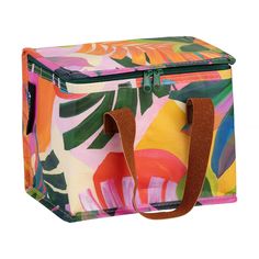 a multicolored tropical print lunch bag with brown handles