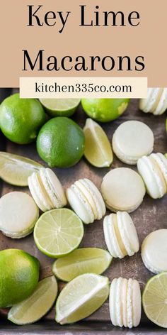 limes and macarons on a cutting board with the words key lime macarons