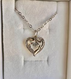 Please be sure to inspect pictures and descriptions carefully as I do not accept returns, exchanges or cancellations Super cute vintage heart pendant on a newer 925 sterling silver chain. --Necklace is light in weight. --Pendant is approximately 1/2 inch and has been put on a newer sterling silver chain. --Chain is approximately 17 inches.  925 STERLING SILVER --Necklace and chain have been cleaned and polished. --There is some slight patina inside and outside which add to the charm. --Pendant is vintage sometime pre 1960. Comes with a gift box and polish cloth. Private estate piece in excellent condition.  The vintage heart pendant was boxed for many years.  There are no markings that I could find on the pendant.  Was told it is sterling silver. It is not magnetic, so I'm inclined to beli Vintage Charm Necklaces For Mother's Day Anniversary, Vintage Charm Necklaces For Anniversary And Mother's Day, Vintage Charm Necklace For Mother's Day Anniversary, Vintage Charm Heart Pendant Necklace For Anniversary, Anniversary Necklace With Vintage Charm And Heart Pendant, Vintage Heart Pendant Charm Necklaces For Mother's Day, Vintage Charm Heart Pendant Necklace For Mother's Day, Vintage Charm Heart Pendant Jewelry For Mother's Day, Vintage Heart Pendant Charm Necklace For Mother's Day