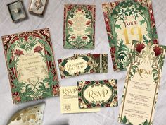 an assortment of wedding stationery items on a table