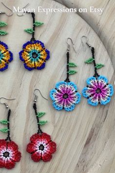 Thank you for your support. Check out Mayan Expressions on Etsy for more colors and designs. Adjustable Multicolor Earrings With Flower Charm, Adjustable Multicolor Flower Charm Earrings, Bohemian Beaded Earrings With Flower Charm, Multicolor Flower-shaped Earrings With Colorful Beads, Bohemian Multicolor Flower Charm Earrings, Handmade Multicolor Beaded Earrings In Flower Shape, Multicolor Beaded Flower Earrings With Flower Charm, Multicolor Flower Beaded Earrings With Dangling Beads, Multicolor Flower Shaped Beaded Earrings With Flower Charm