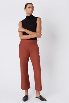 Fall calls for ease with our elastic waist Brit Crop Pant. With a mid-rise fit, angle seam pockets and the perfect leg opening, this style is a breeze to wear in the cooler weather. Pair it with your favorite ankle boot or sneaker, this style is designed for women on the go.THIS ITEM IS FINAL SALE. 1.5" front waistband, elastic at sides and back, angle seams with front pockets, midrise, easy fit, clean finish hem. - 51% Cotton, 49% Nylon - Fabric Woven in Italy - Made in NYC - Professional dry c Fitted Straight Pants With Pull-on Style, Business Casual Straight Dress Pants With Pull-on Style, Versatile Fall Bottoms With Comfort Waistband, Fall Bottoms With Pull-on Style And Tapered Leg, Casual Straight Leg Pull-on Dress Pants, Versatile Bottoms With Comfort Waistband For Fall, Versatile Straight Leg Bottoms For Fall, Versatile Straight Dress Pants With Elastic Waistband, Fall Relaxed Fit Pull-on Pants