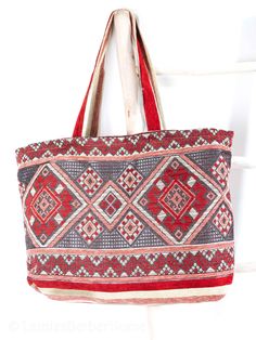 Whether you're going to the beach, or going just for a walk, Our Berber Bags got you covered. They are stylish, yet spacious enough to hold your essentials. Our handmade bags are made by skilled women in the Atlas Mountains in Morocco using only the highest quality materials. With attention to detail and quality that stands the test of time.  The bags are handcrafted from a beautiful woven fabric, 100% cotton that is lightweight, yet durable and elegant.  The bag has no zip for easy access to your items. It is lined inside and offers one large pocket.  Measurements: Width- 62 cm Height- 42 cm Handle Height- 34cm To get back to my shop, click here: https://www.etsy.com/uk/shop/LamiasBerberHome Say Hi on Instagram @lamiasberberhome Travel Tote Beach Bag With Handles, Natural Beach Bag With Removable Pouch For Travel, Bohemian Pouch Beach Bag For Shopping, Bohemian Bags With Removable Pouch For Vacation, Red Rectangular Beach Bag With Adjustable Strap, Beach Shoulder Bag With Removable Pouch For Travel, Red Large Capacity Beach Bag For Vacation, Travel Beach Shoulder Bag With Removable Pouch, Large Capacity Red Beach Bag For Travel