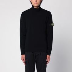 Black wool-blend Stone Island jumper featuring a high collar, long sleeves with Compass logo label and straight hem. Fall Sweater With Logo Patch, Fall Long Sleeve Sweater With Logo Patch, Fall Long Sleeve Sweatshirt With Logo Patch, Winter Long Sleeve Sweatshirt With Logo Patch, Crew Neck Sweater With Logo Patch For Fall, Fall Crew Neck Sweater With Logo Patch, Crew Neck Sweater With Logo Patch For Winter, Winter Crew Neck Sweater With Logo Patch, Wool High Neck Sweater With Ribbed Cuffs