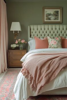 a bed with pink and white pillows in a bedroom