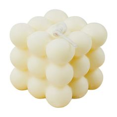 a bunch of white balls sitting on top of each other in front of a white background