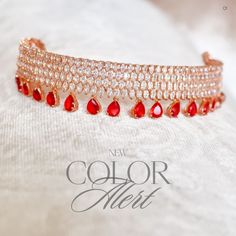 A captivating ensemble expertly crafted to effortlessly elevate your style! Crafted with precision, this choker set boasts with stunning CZ stone work that is perfectly complemented by dangling garnet stones - adding a touch of allure, making it the perfect choice for any occasion. The set includes a choker and a pair of straight-drop earrings. Approximate earrings length is 1.5". Rose-gold plated on high-quality brass as base metal. Made by order. Kindly allow 5-7 weeks for the delivery of this Choker Set, Garnet Stone, Stone Work, Cz Stone, Elevate Your Style, Base Metal, Rose Gold Plates, Your Style, New Color