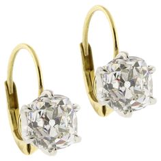 Indulge in the allure of timeless elegance with these exquisite Old Mine Cut Diamond Earrings. Featuring two stunning diamonds weighing 1.66 carats and 1.65 carats respectively, for a total of 3.31 carats, these earrings capture the enchanting brilliance of a bygone era. Each diamond, with a captivating H color and clarity ranging from VS1 to SI1, is securely set in a classic 6-prong setting that enhances its unique sparkle and fire. The old mine cut, known for its charming, slightly irregular s Luxury Vintage Earrings With Single Cut Diamonds, Luxury Platinum Diamond Earrings Hallmarked, Timeless Diamond Cut Diamond Earrings For Wedding, Timeless Diamond Cut Earrings For Wedding, Luxury Brilliant Cut Yellow Gold Diamond Earrings, Luxury Yellow Gold Brilliant Cut Diamond Earrings, Luxury Yellow Gold Diamond Earrings With Brilliant Cut, Formal Dazzling Diamond Earrings With Single Cut Diamonds, Luxury Formal Diamond Earrings With Brilliant Cut