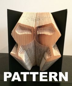 an origami book folded into the shape of a face