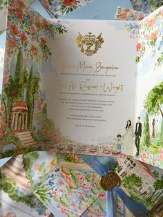 an open wedding card with a couple in the background and flowers all over it,