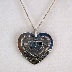 "This antiqued sterling silver, two-sided, solid Forever and Ever Heart pendant features a double-pierced heart design with \"Forever\" inscribed on the front and \"And Ever\" inscribed on the back. Marked, Sterling. Made by Brown County Silver. Vintage and in new, never worn condition. Approximately 30 years old. 1 1/8\" high with jump ring 1 1/8\" wide 6.9 grams See more @ https://www.etsy.com/shop/brocosi" Silver Sterling Heart Necklace For Memorial, Nickel-free Heart Necklace For Anniversary, Nickel Free Double Heart Jewelry For Anniversary, Vintage Nickel-free Heart Necklace For Anniversary, Nickel-free Double Heart Necklace For Anniversary, Personalized Vintage Silver Heart Necklace, Silver Heart Necklace With Hallmark, Nickel Free Jewelry For Anniversary On Valentine's Day, Vintage Sterling Silver Heart Necklace Nickel Free